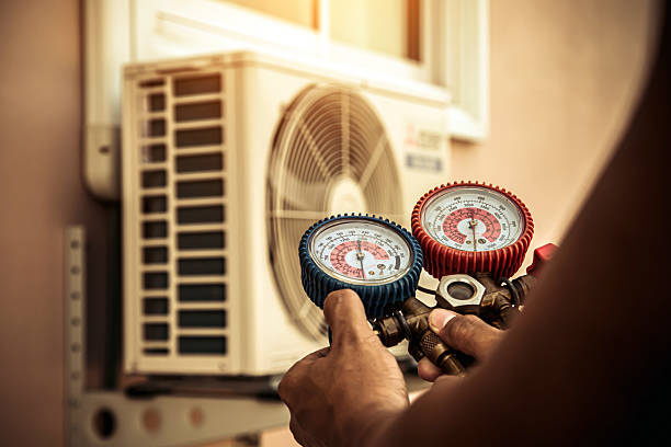 Professional Air Conditioning Service technician working in Alix, AR